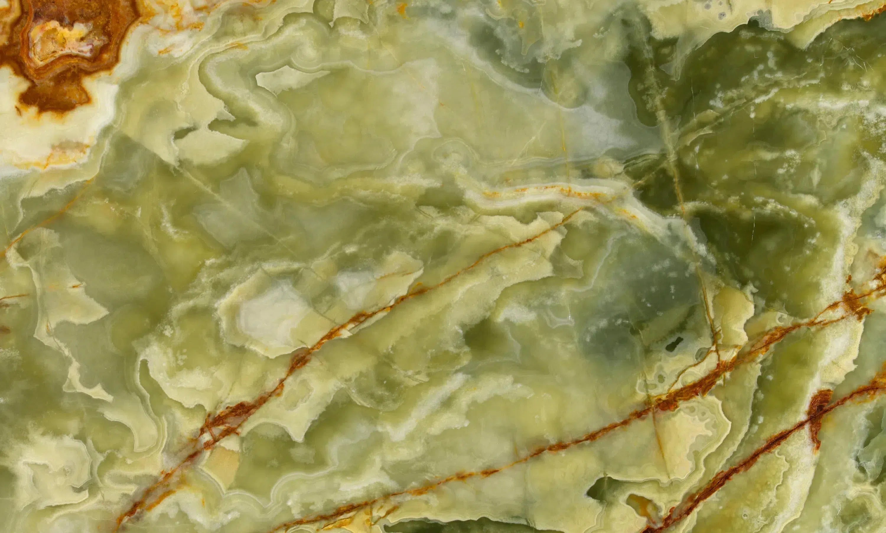 Green Onyx slab showcasing rich brown veining in the Green Onyx Marble collection.
