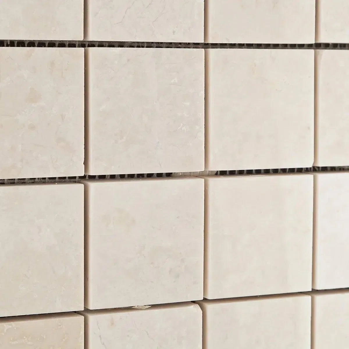 Square beige mosaic tiles in the White Pearl/Botticino Beige Marble collection.