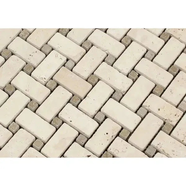 Herringbone brick and stone mosaic in Ivory Travertine with Noce dots tumbled finish