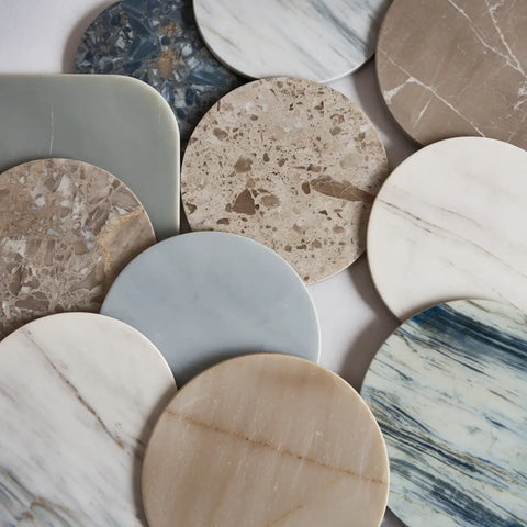 Assorted marble coasters from the Honed collection displayed together