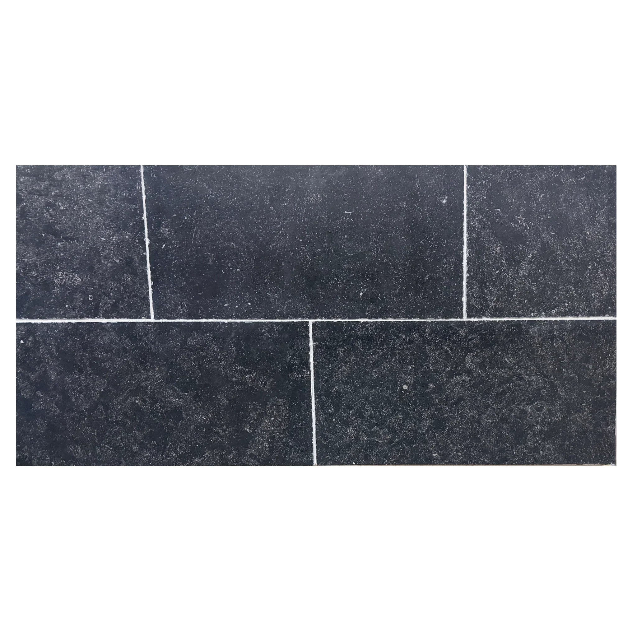 Dark gray Obsidian Ash Limestone tiles with speckled texture and white grout.