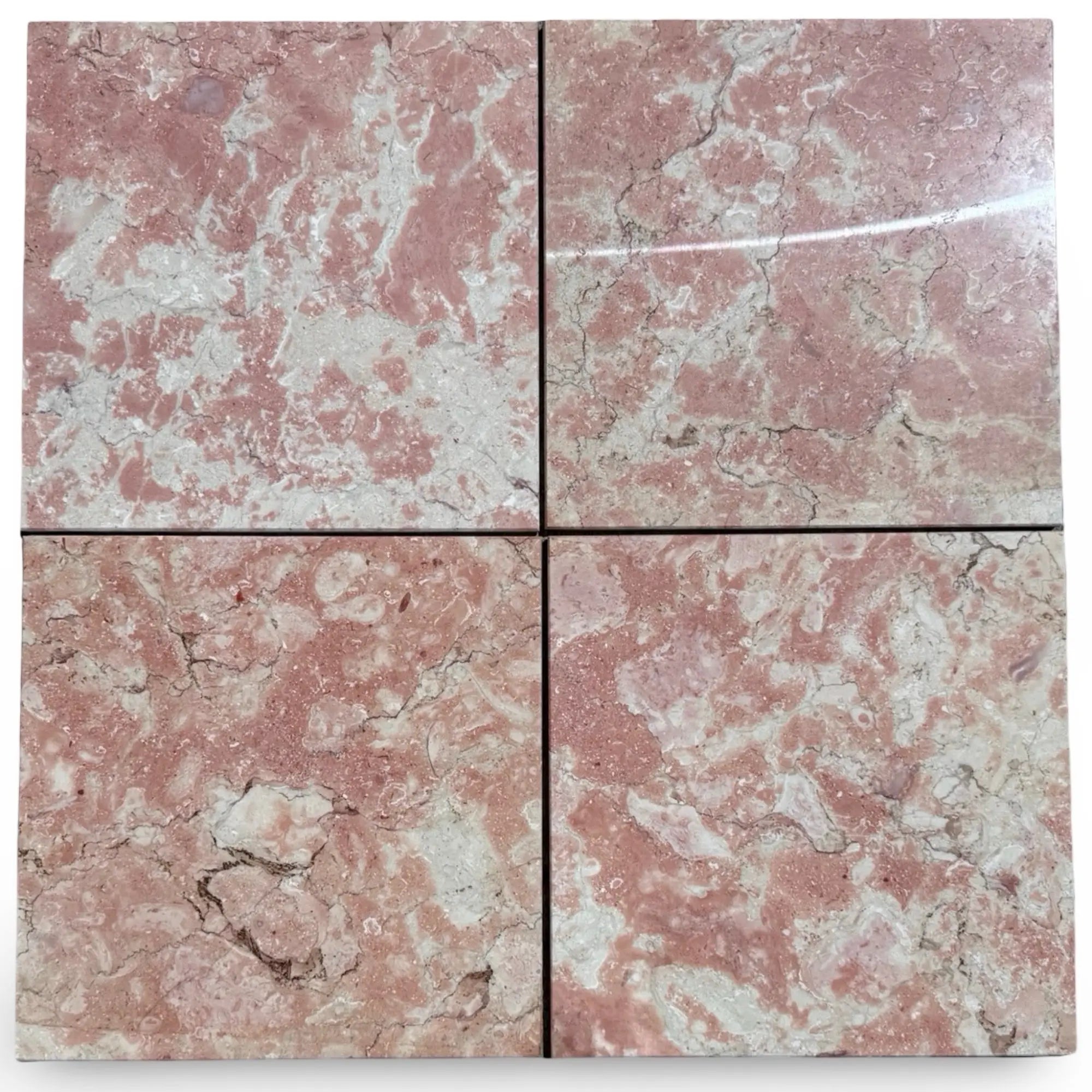 Four polished Rosé Aurora Marble tiles with reddish-pink color and elegant veining
