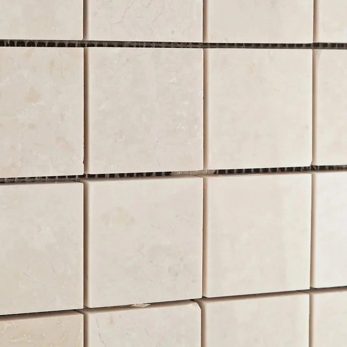 Square beige mosaic tiles in the White Pearl/Botticino Beige Marble collection.