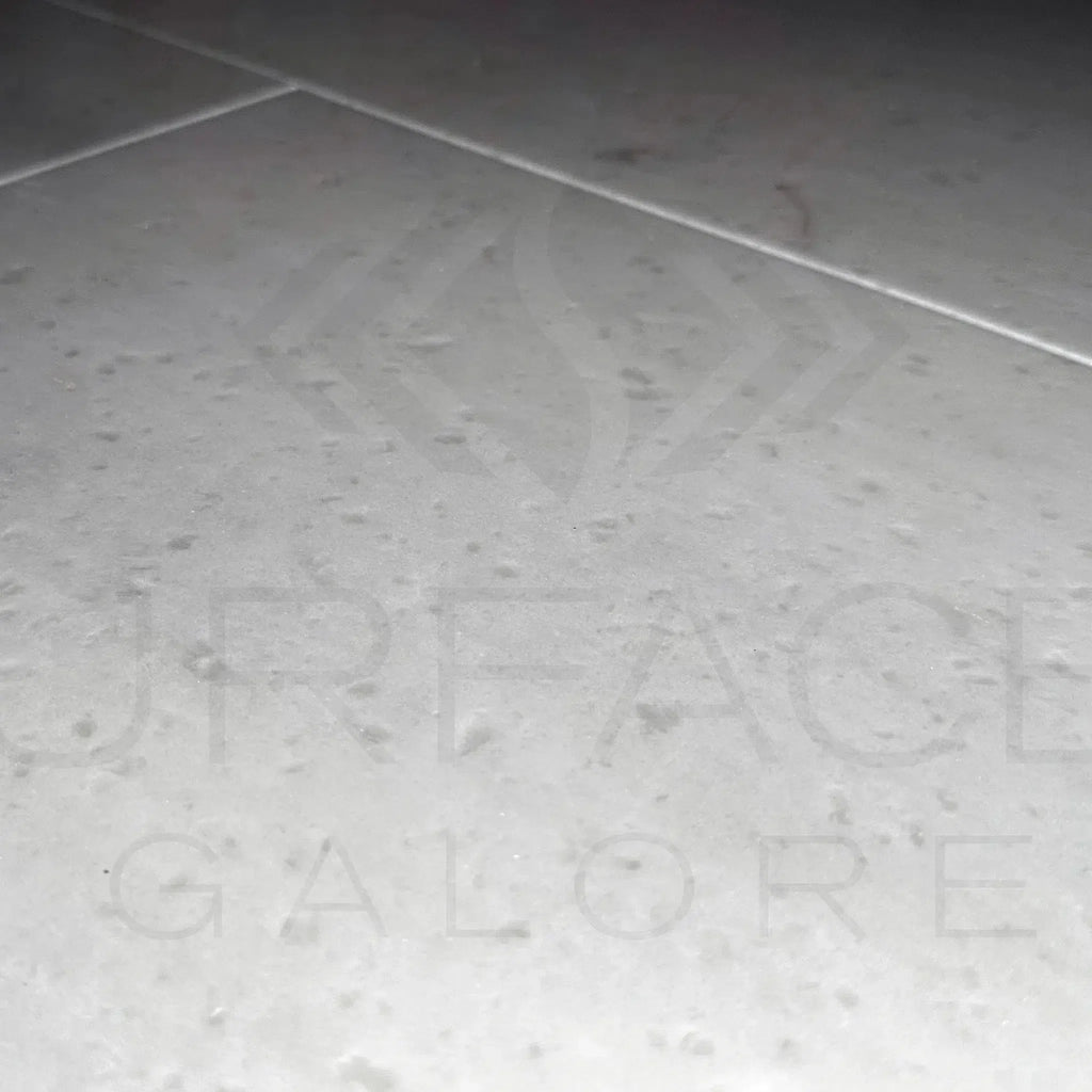 Gray tiled floor showcasing Agean White Marble 12X24 Polished Tile for elegant decor