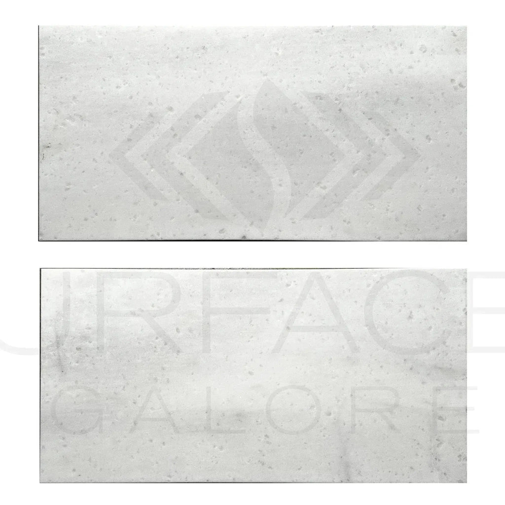 Two speckled rectangular Aegean White Marble tiles, 12X24, polished finish