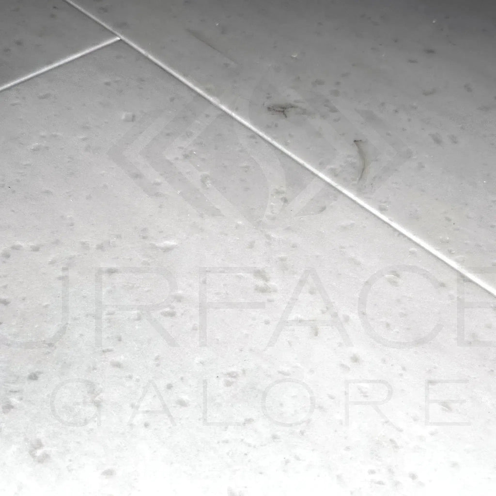 Light gray speckled Agean White Marble Polished Tile 12X24 for $7.49 per sq. ft