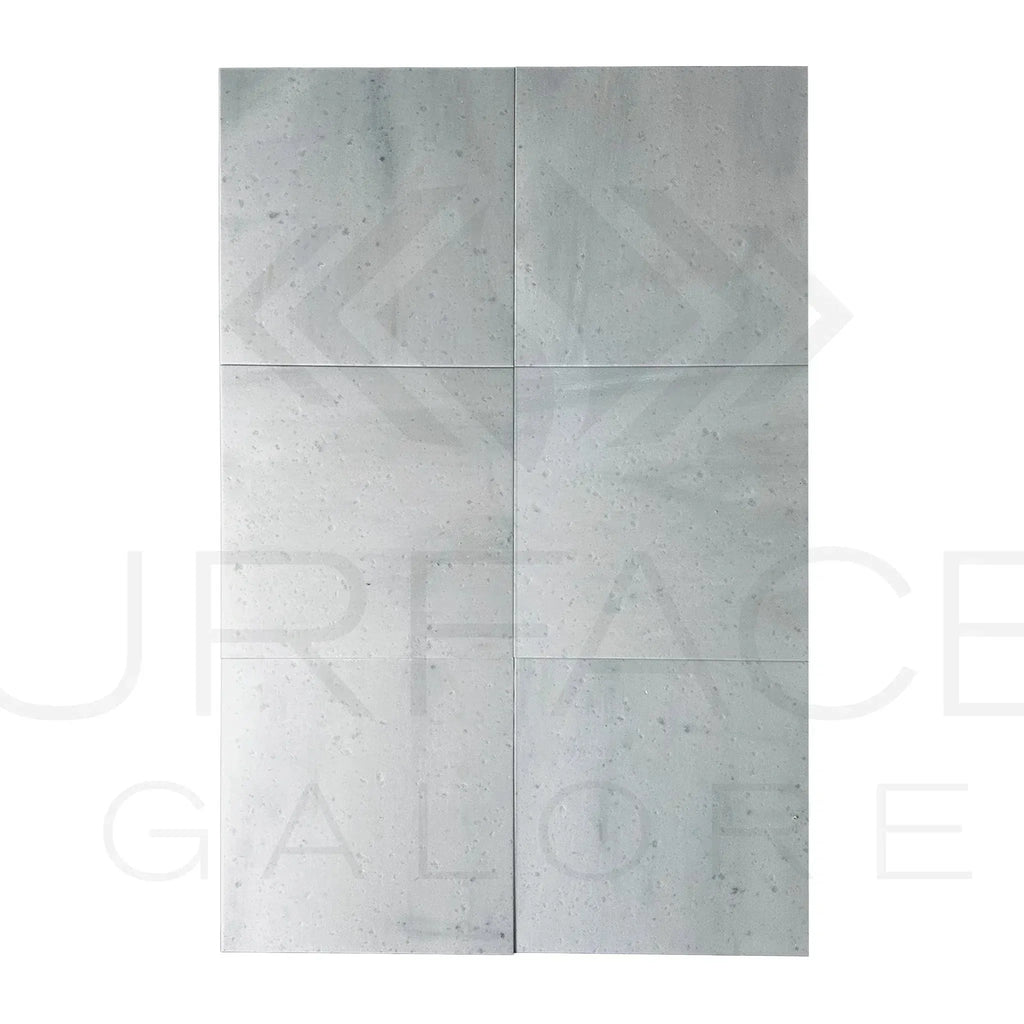 Rectangular gray tile arrangement featuring Agean White Marble 18X18 Polished Tile