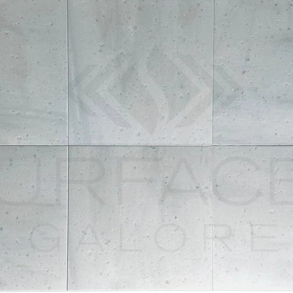 White speckled surface of Agean White Marble 18X18 Polished Tile for elegant interiors