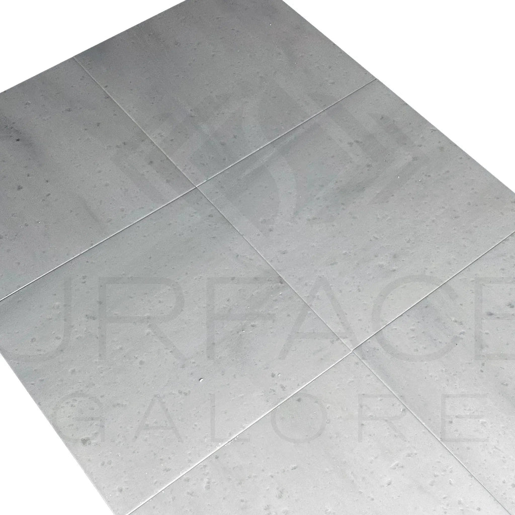 Gray stone floor tiles showcasing Agean White Marble Snow White Polished Tile 18X18