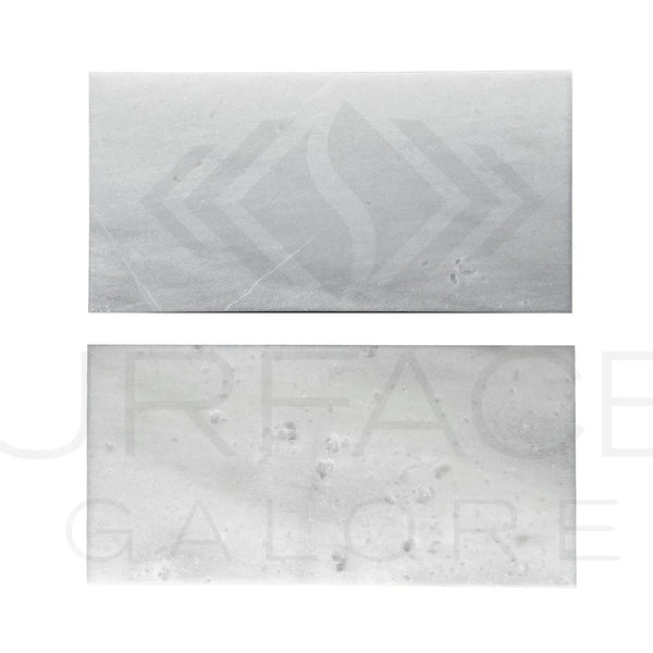 Two rectangular bars of soap displayed with Agean White Snow White Marble Tile