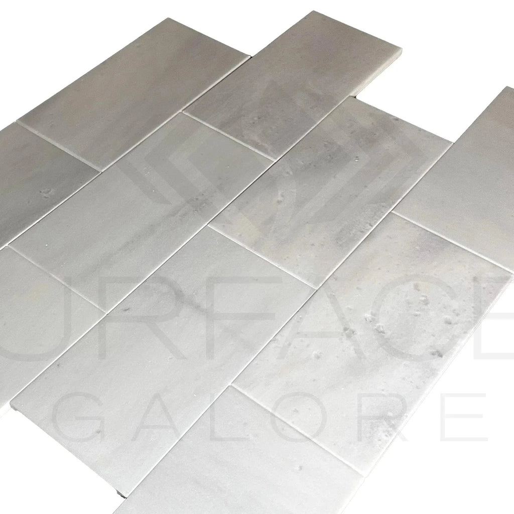 Gray rectangular tiles of Aegean White Snow White Marble 6X12 Polished Tile