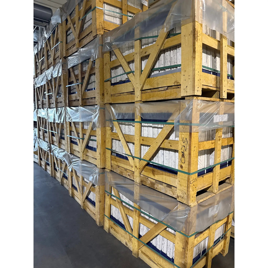 Stacked wooden crates with wrapped contents for Alabastrino Rustic White Vein-Cut Travertine