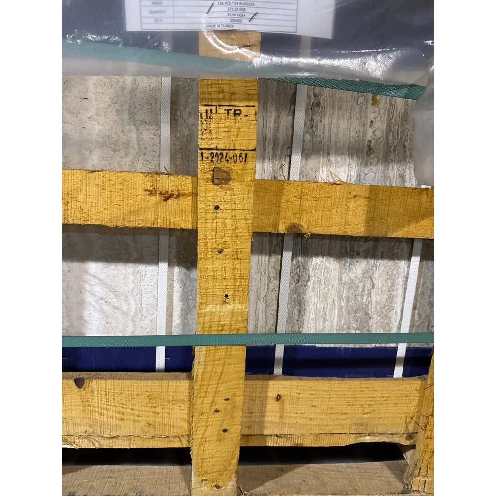 Wooden pallet with stacked Alabastrino Rustic White Vein-Cut Travertine tiles