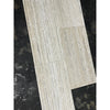 Light gray stone-effect vinyl plank with Alabastrino Rustic White travertine grain