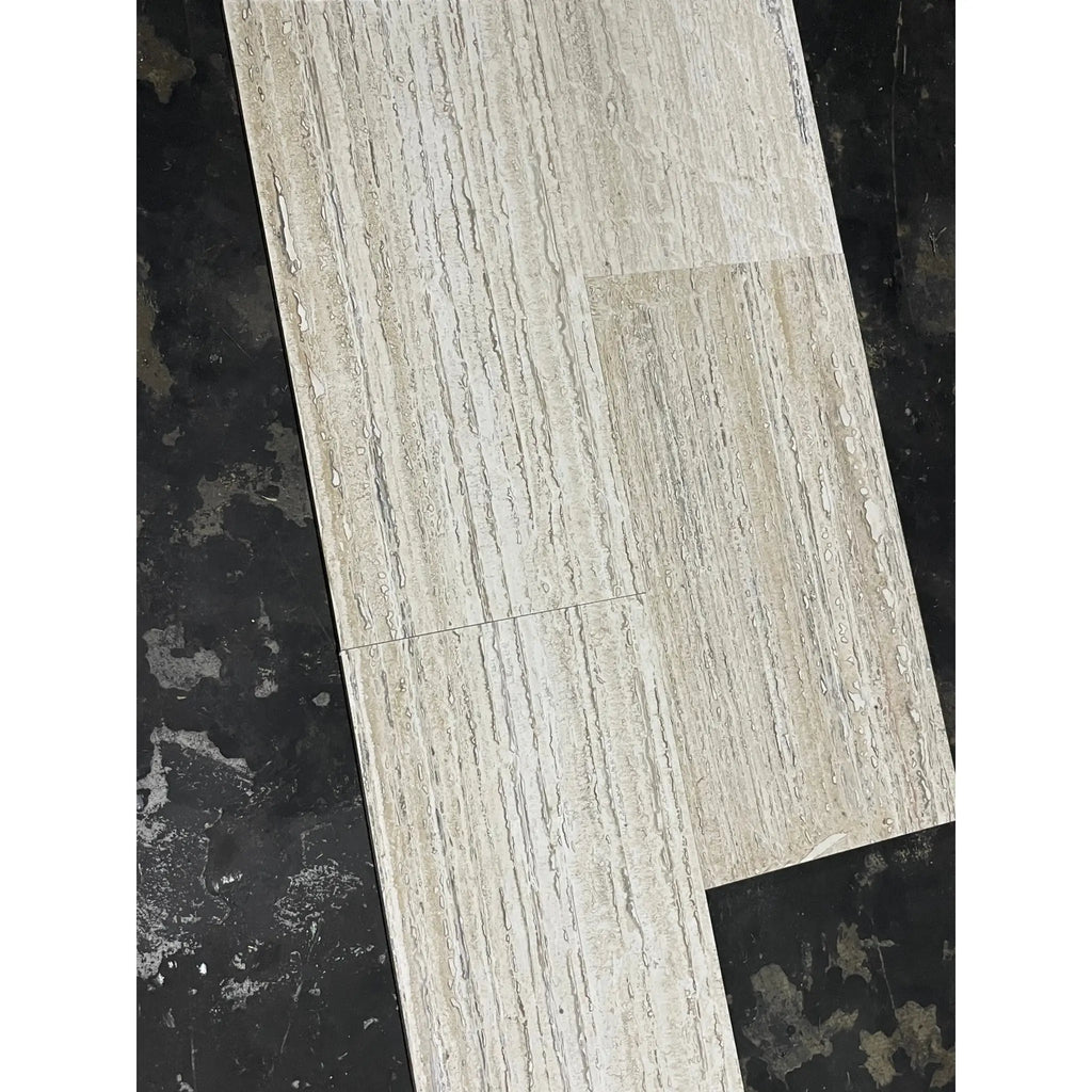 Light gray stone-effect vinyl plank with Alabastrino Rustic White travertine grain