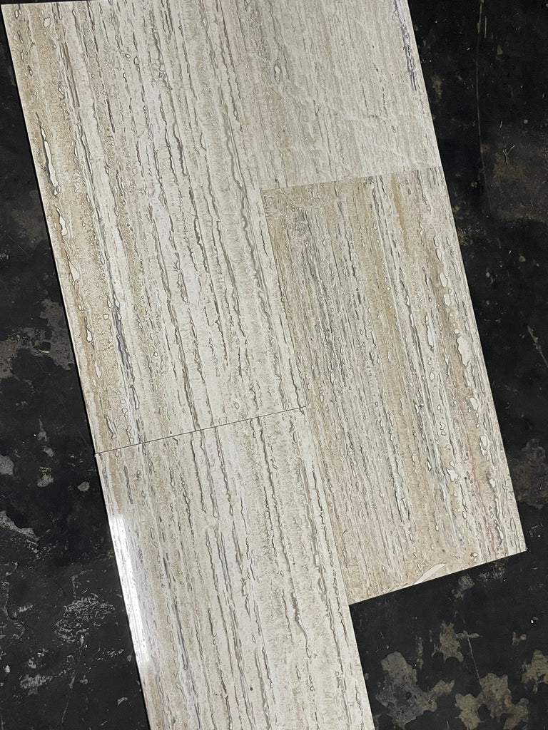 Light gray wood-grain vinyl plank flooring with glossy finish