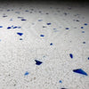 Andromeda Quartz engineered stone tile with white surface and blue flecks, 24X24 inches