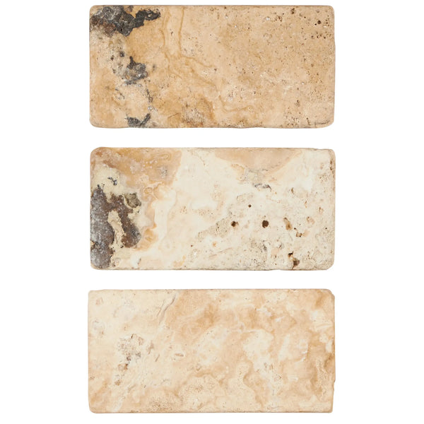 Three rectangular Antico Onyx Travertine 3X6 Tumbled tiles showcasing natural texture
