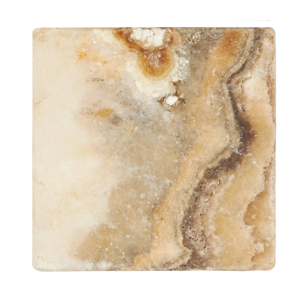 Square marble tile featuring brown veining in Antico Onyx Travertine 6X6 Tumbled