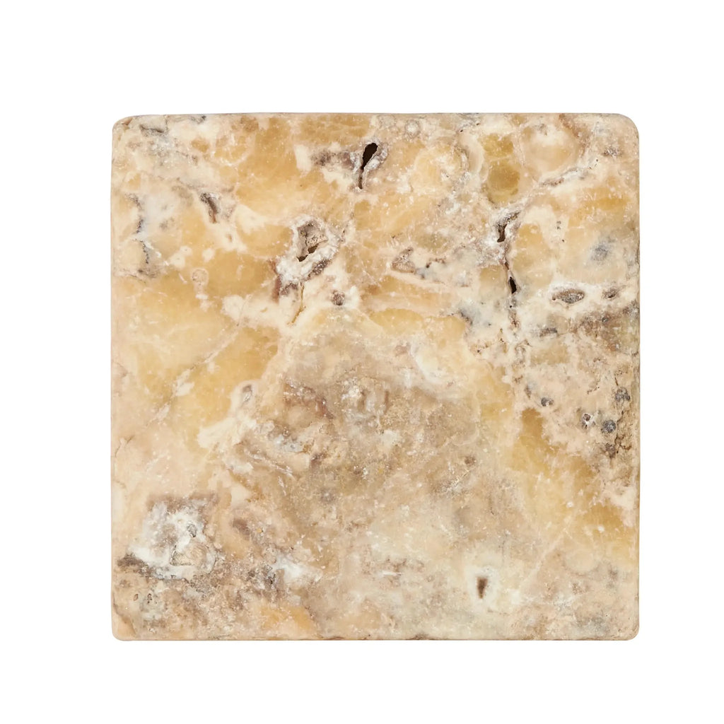 Square tan and white marble piece from Antico Onyx Travertine 6X6 Tumbled collection