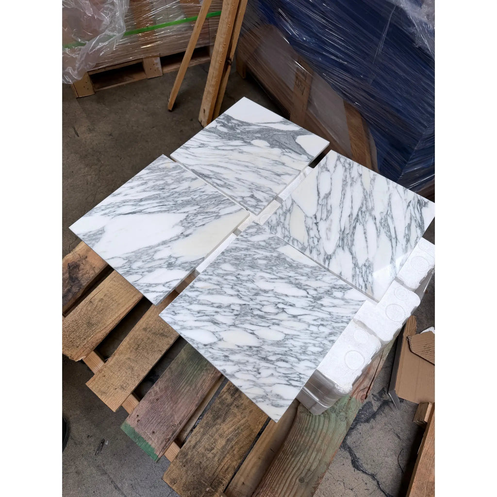 Polished white Arabescato Corchia marble tiles with elegant gray veining for sophisticated flooring