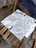 Polished white Arabescato Corchia marble tiles with elegant gray veining for sophisticated flooring