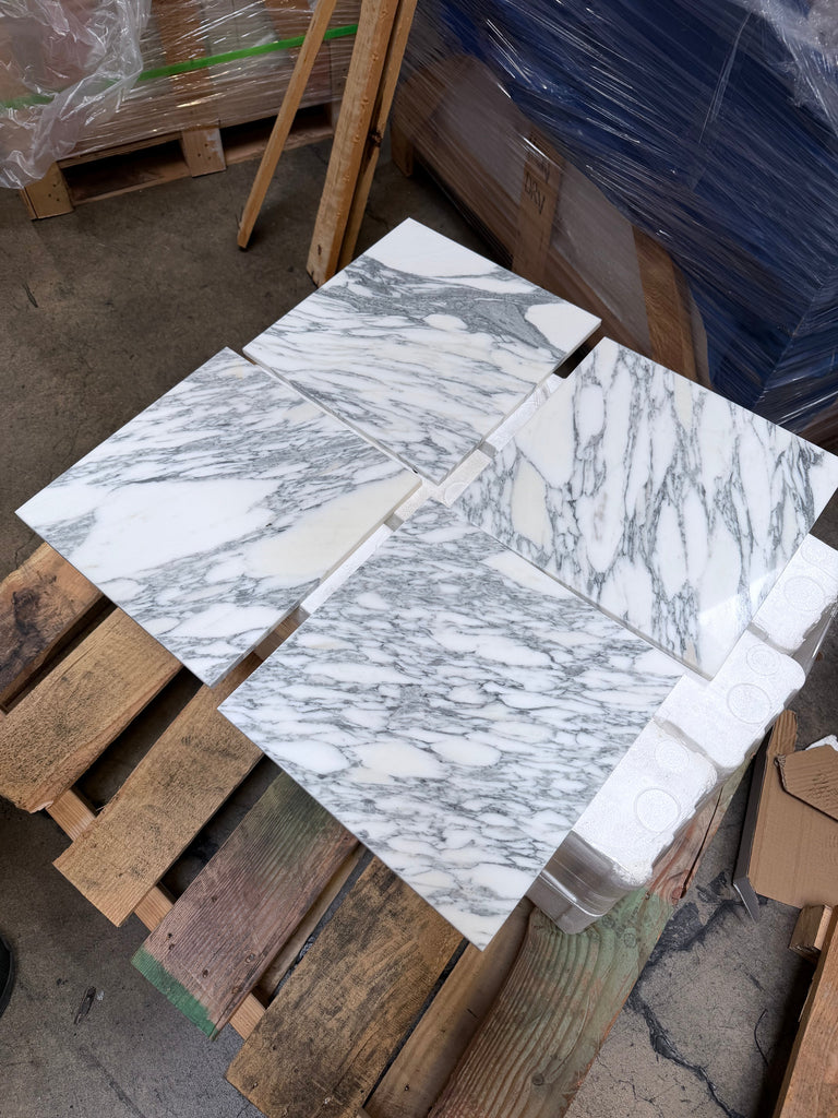 Polished white Arabescato Corchia marble tiles with elegant gray veining for sophisticated flooring
