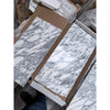 White and gray Arabescato Corchia marble tile in 12x24 polished slabs with natural veining, in open boxes