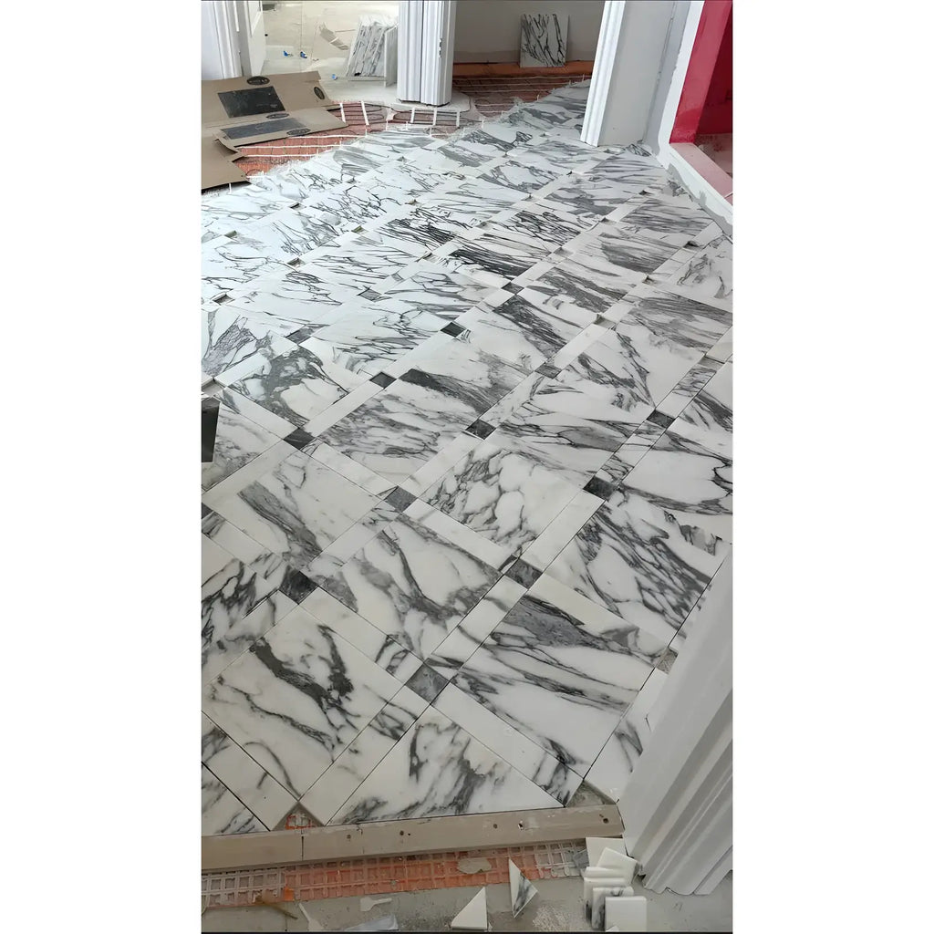 Marble tiled floor featuring Arabescato Corchia 12X24 Marble Tile Polished or Honed