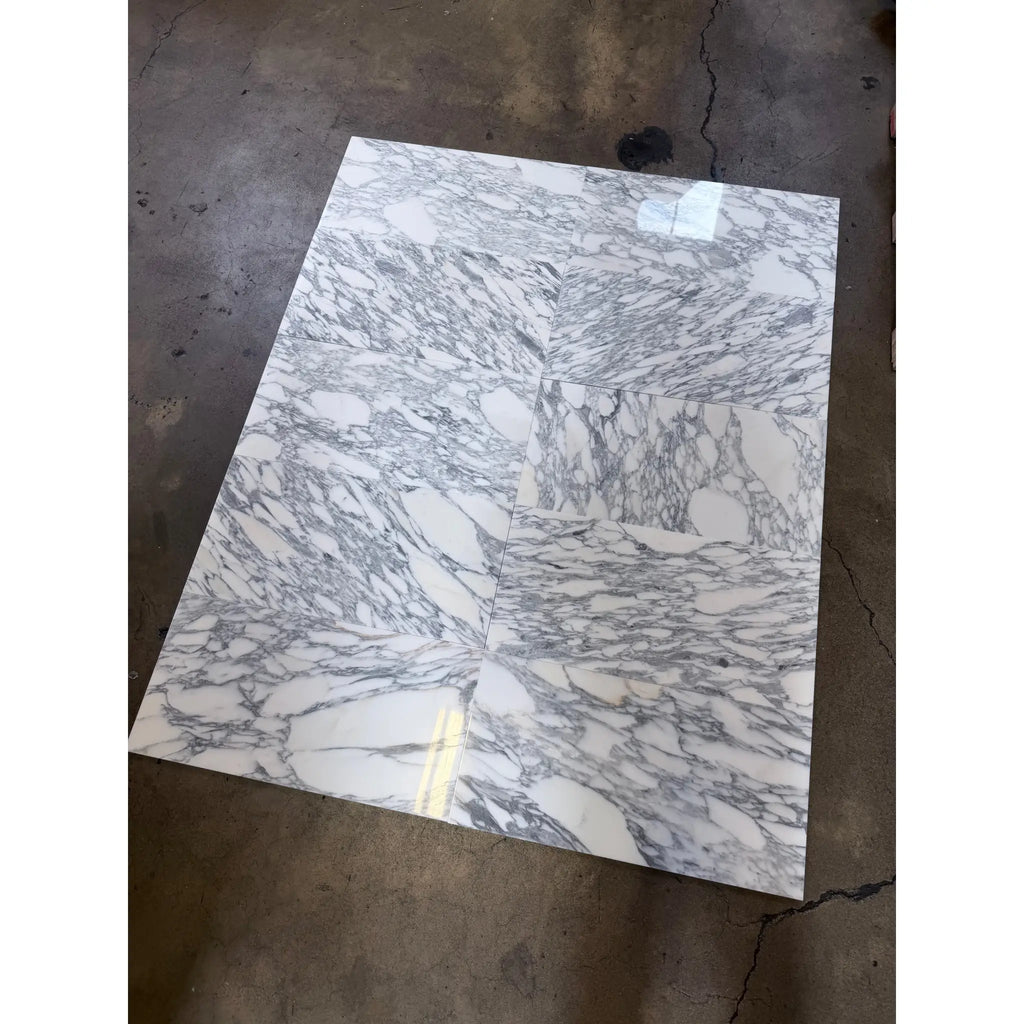 Polished Arabescato Corchia 12x24 marble tile with white base, gray veining, gold accents