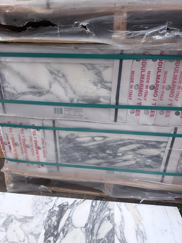 Arabescato Corchia 12x24 polished marble tile with white gray veining in plastic wrap