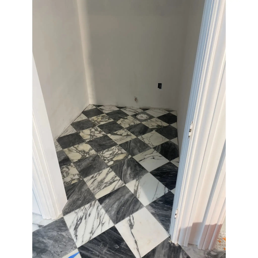 Black and white checkered marble floor featuring Arabescato Corchia 18X18 tile