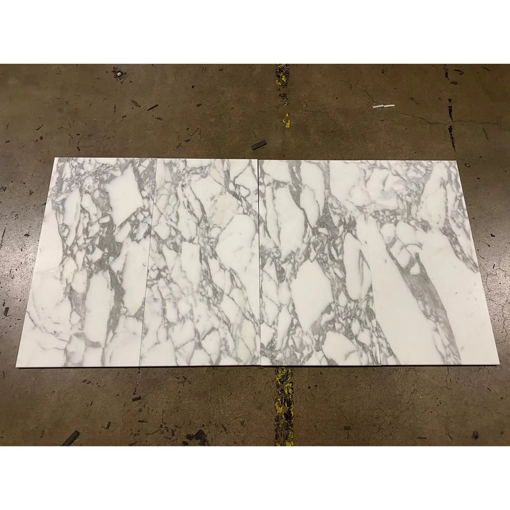 Two Arabescato Corchia 18X18 marble tiles showcasing elegant marble patterns