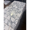 Stack of Arabescato Corchia 2x2 white marble mosaic tiles with gray veining