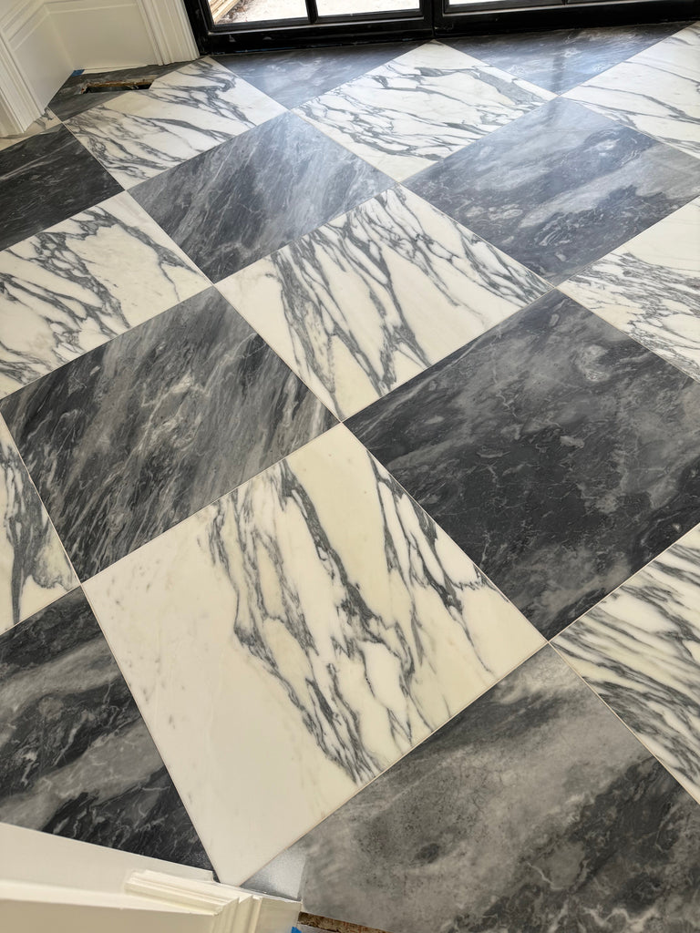 Black and white Arabescato Corchia marble tile in 24x24 checkered pattern