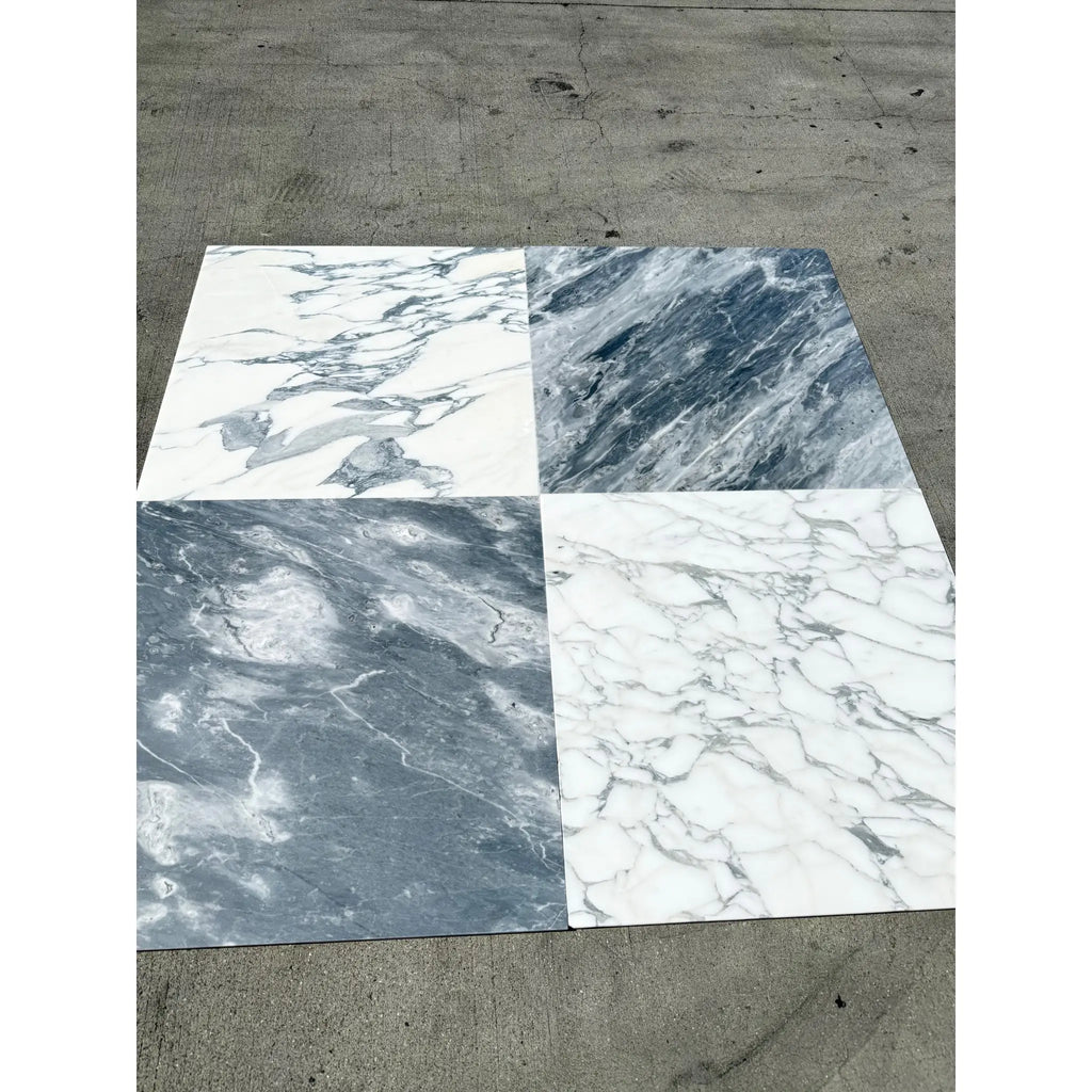 Four marble-effect tile samples in white and grey for Arabescato Corchia 24x24 marble tile