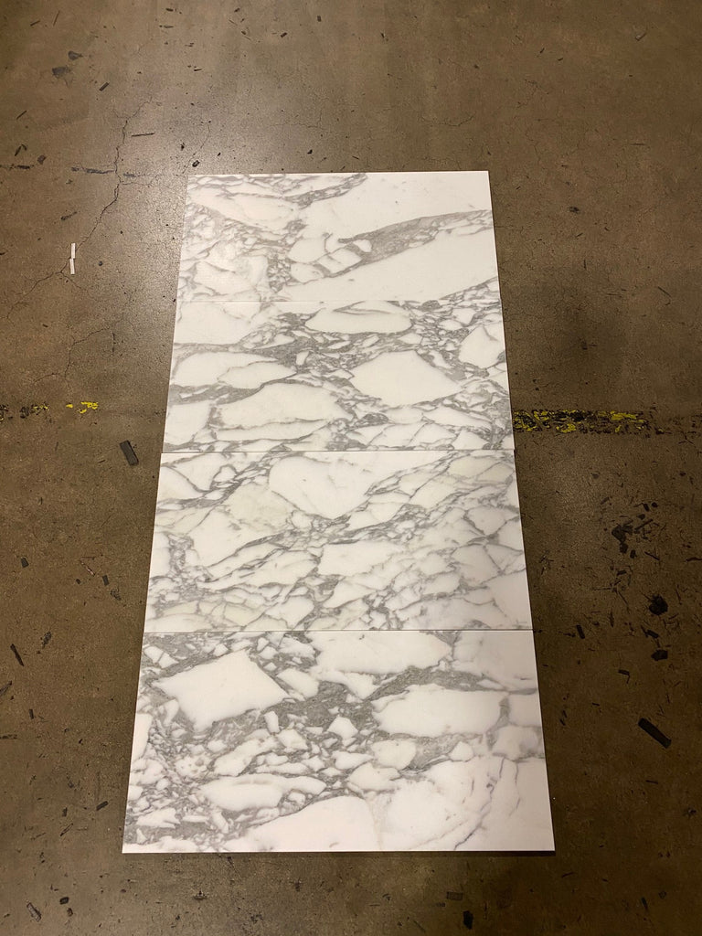 Rectangular Arabescato Corchia marble tiles with a polished or honed marble pattern
