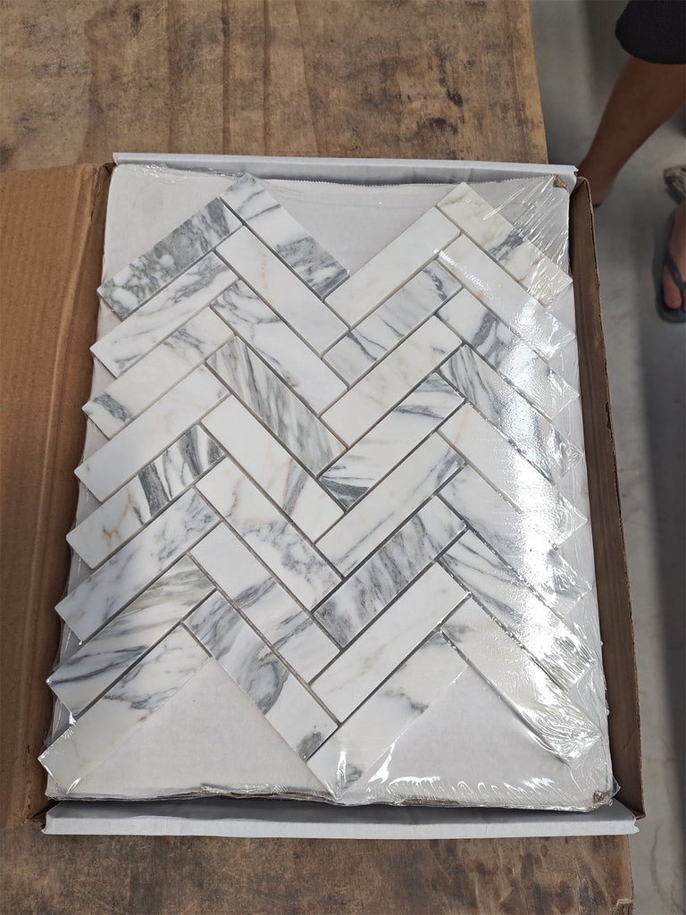 Arabescato Corchia white marble mosaic tiles in herringbone pattern
