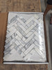 Arabescato Corchia white marble mosaic tiles in herringbone pattern