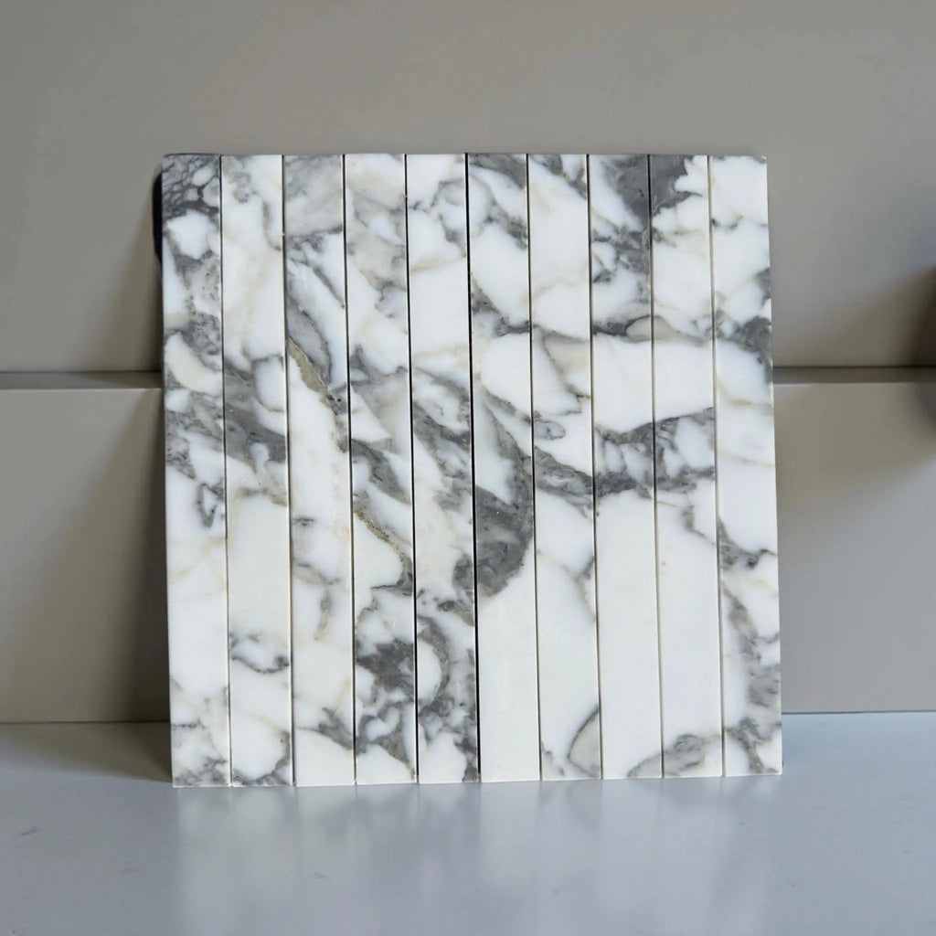 Marble-patterned tile strips of Arabescato Corchia Marble 1 1/8 X 12 Mosaic design
