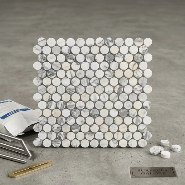 White and gray marble arabescato corchia pennyround polished tile with circular pieces arranged in a grid pattern