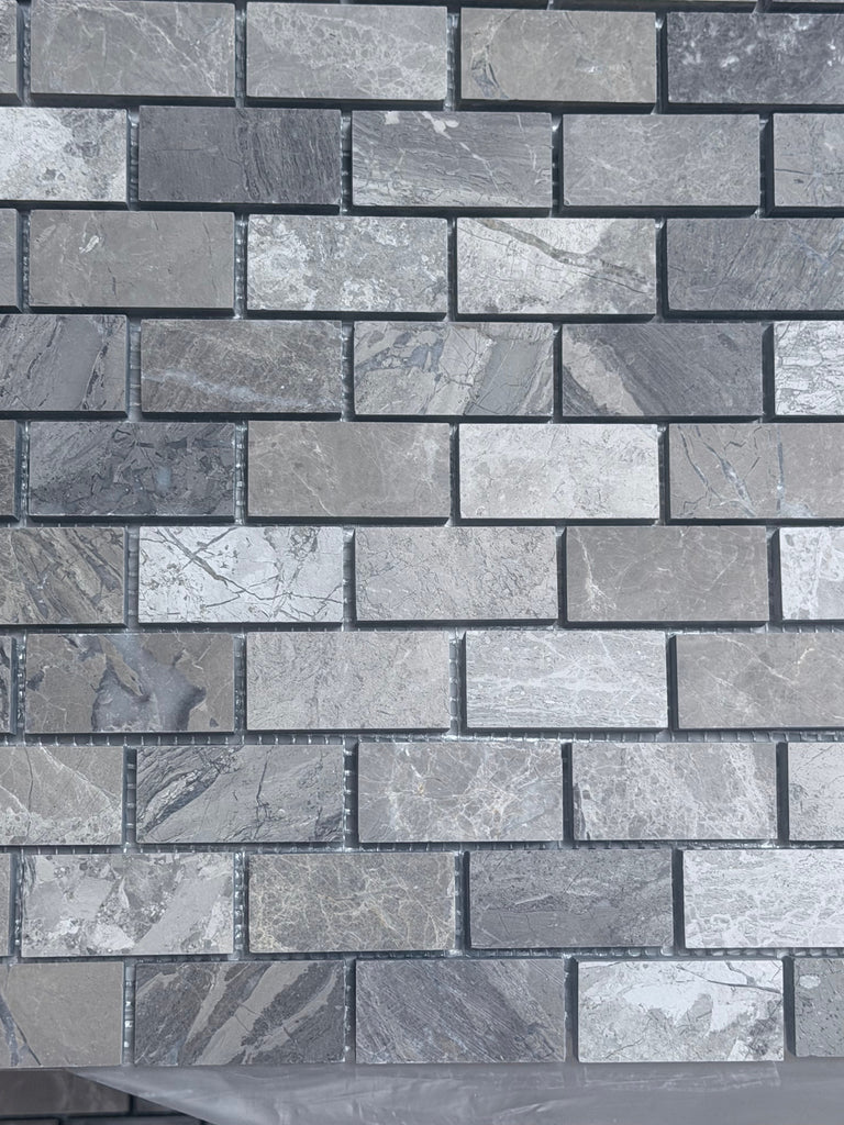 Gray marble-effect brick mosaic tile wall in Atlantic Gray Marble 1x2 polished or honed