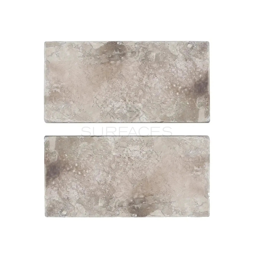 Atlantic Gray Marble 3X6 Tumbled showcasing two rectangular stone tiles