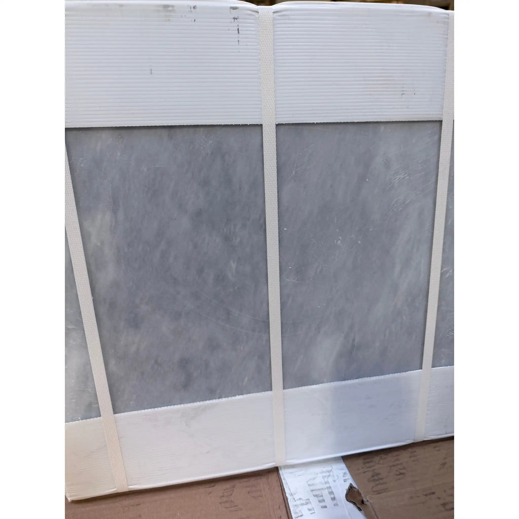 Azure Imperio 12x12 gray marble tile with subtle veining in white packaging