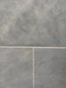 Azure Imperio 12x12 gray marble tile with subtle veining and light grout