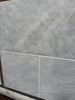 Azure Imperio 12x12 marble tile in light gray with subtle veining and polished surface