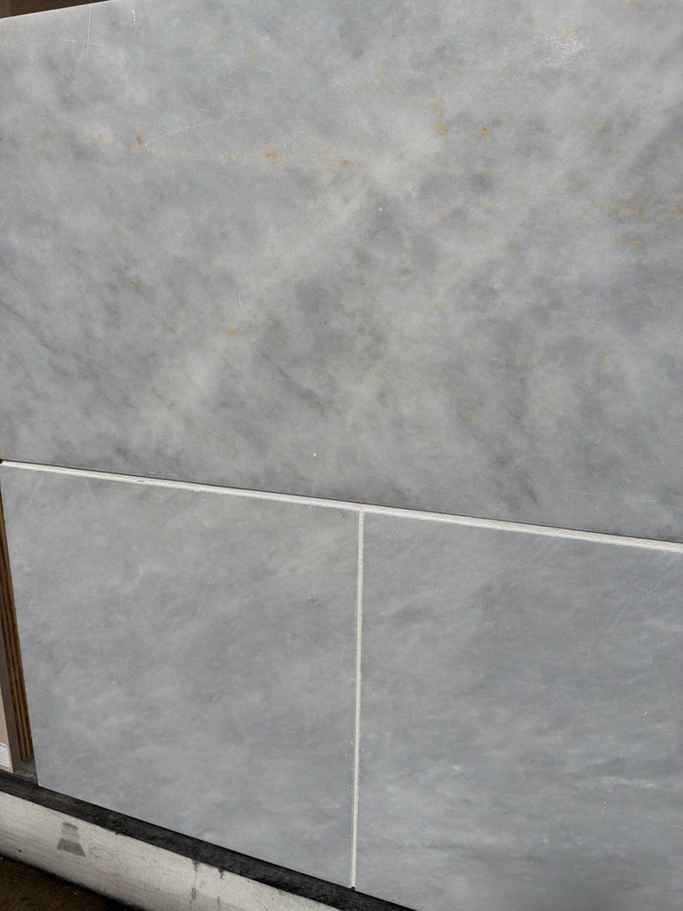 Azure Imperio 12x12 marble tile in light gray with subtle veining and polished surface