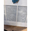 Azure Imperio 12x12 marble tile with white panelled wall, grey marble-effect panels, and white trim