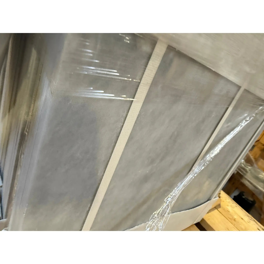 Stack of gray Azure Imperio 18x18 marble tile panels in clear plastic wrap