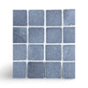 Square grid of Bardiglio 3X3 Tumbled dark gray stone tiles with white speckles and veining